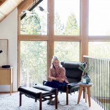Interior designer Emily Henderson and her Inca chair handmade in Sweden by Norell Furniture. Design: Arne Norell.